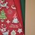 Karácsonyi manók és szarvasok (bordó) dekorszövet